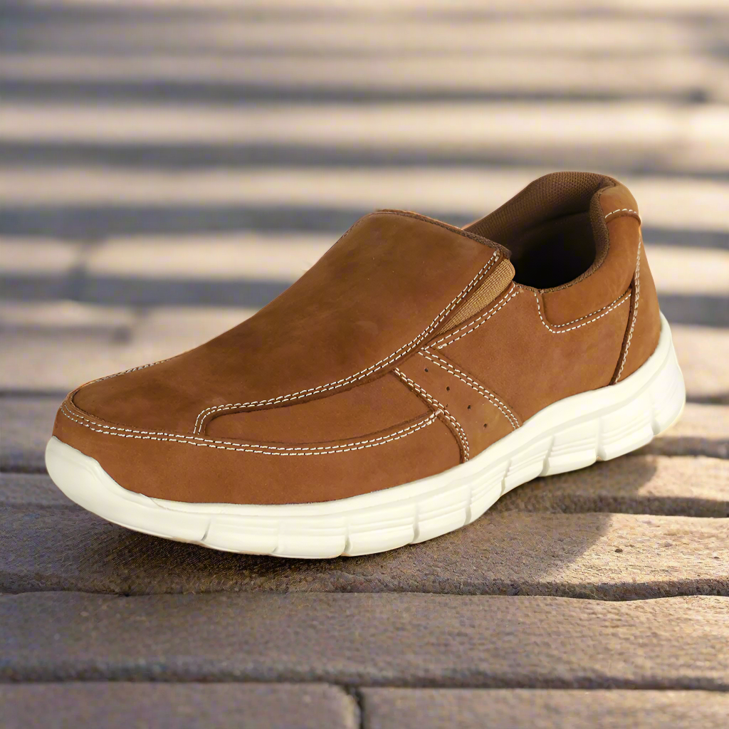 A brown Activ casual shoe on a wooden surface.