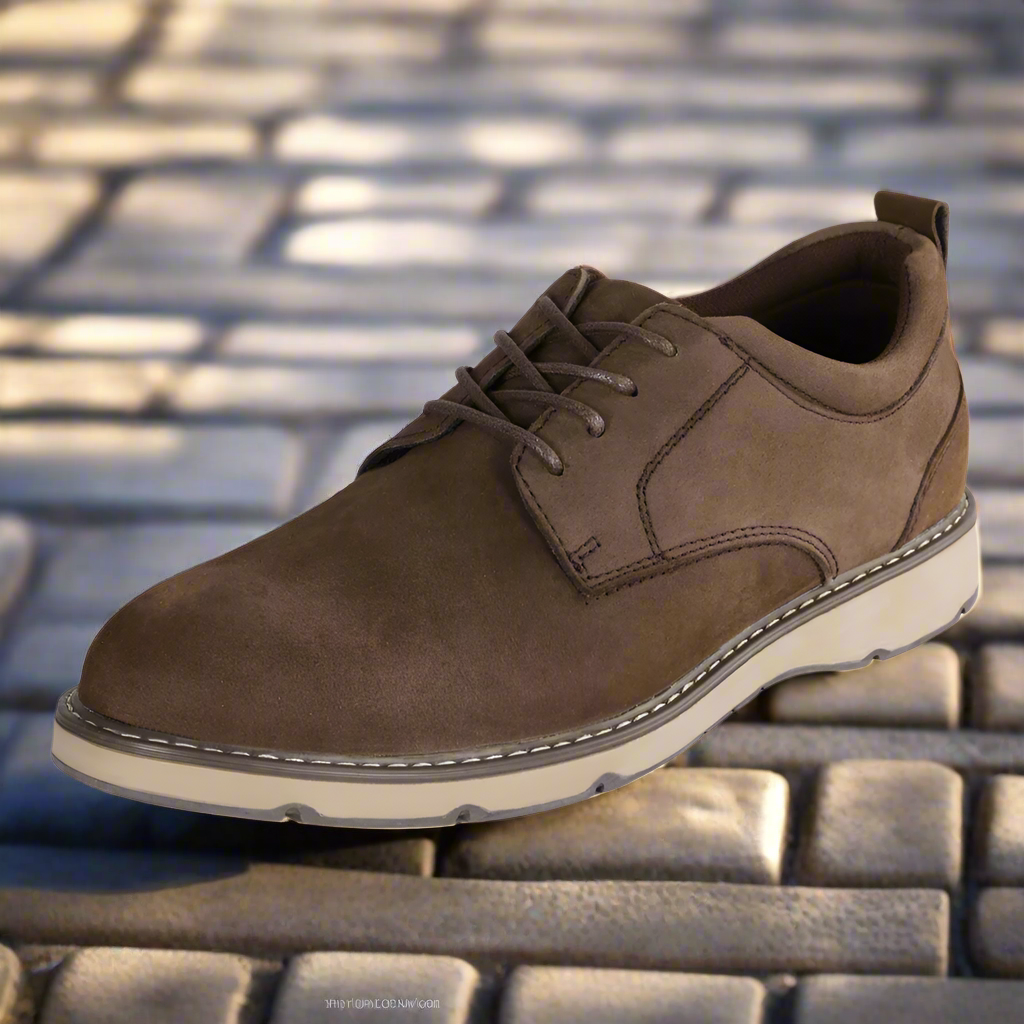 A brown Activ casual shoe for men displayed against a textured background.
