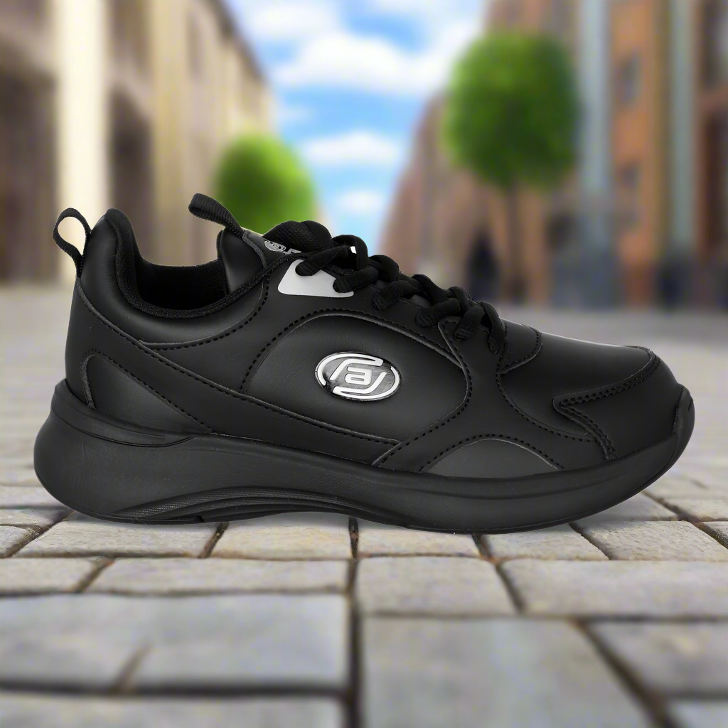 Black athletic shoe with a brand logo on a blurred street background