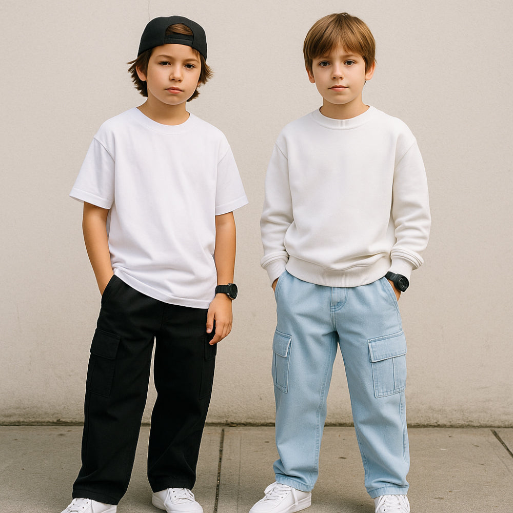 Two children standing side by side against a plain background