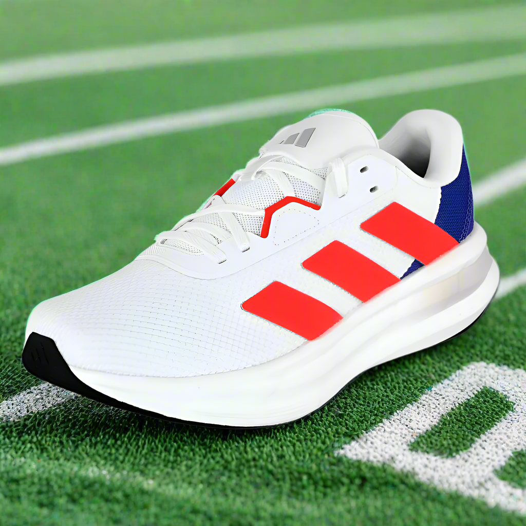 White running shoe with red and blue accents on a white background