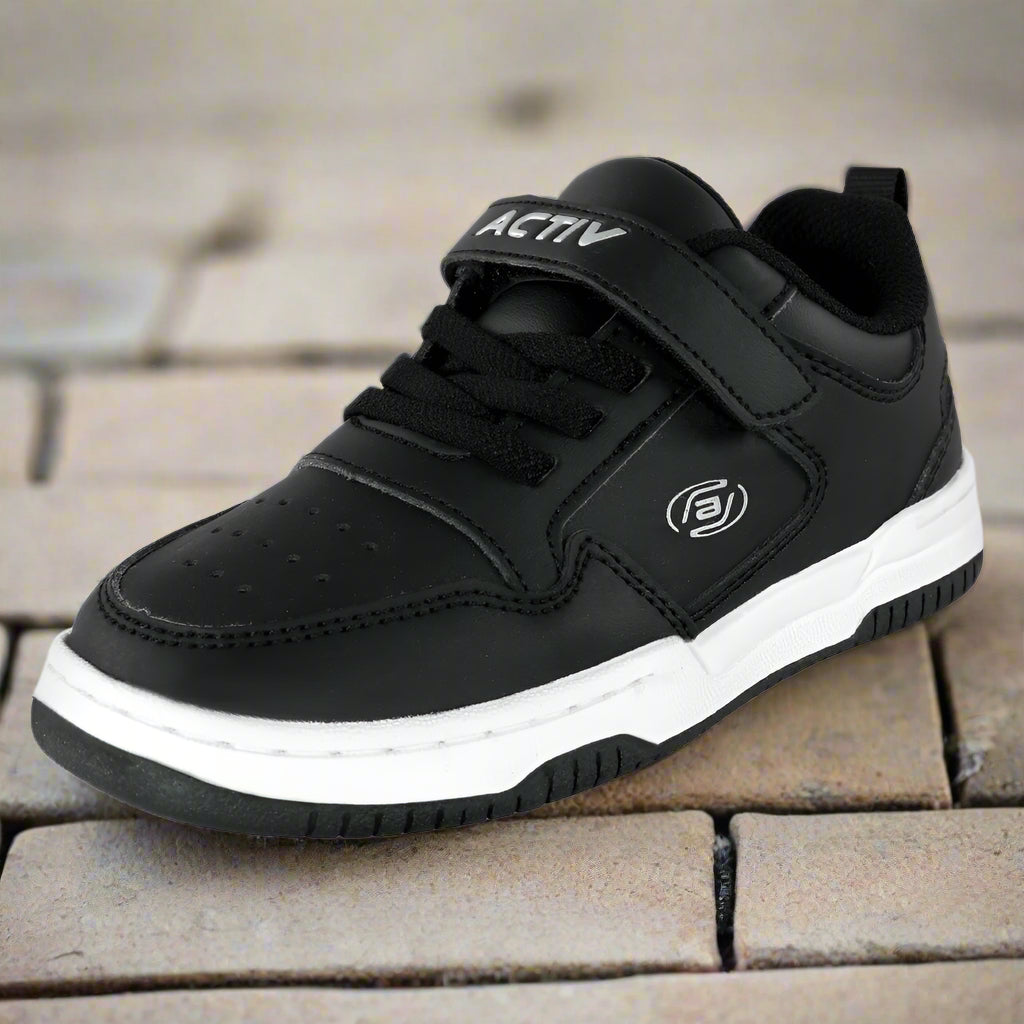Black athletic shoe with a white sole on a white background